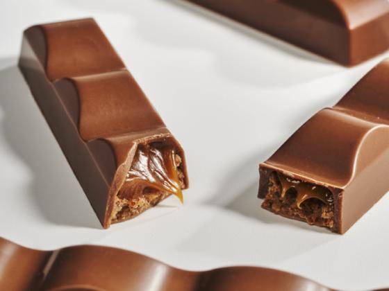 chocolate bars with filling on white background